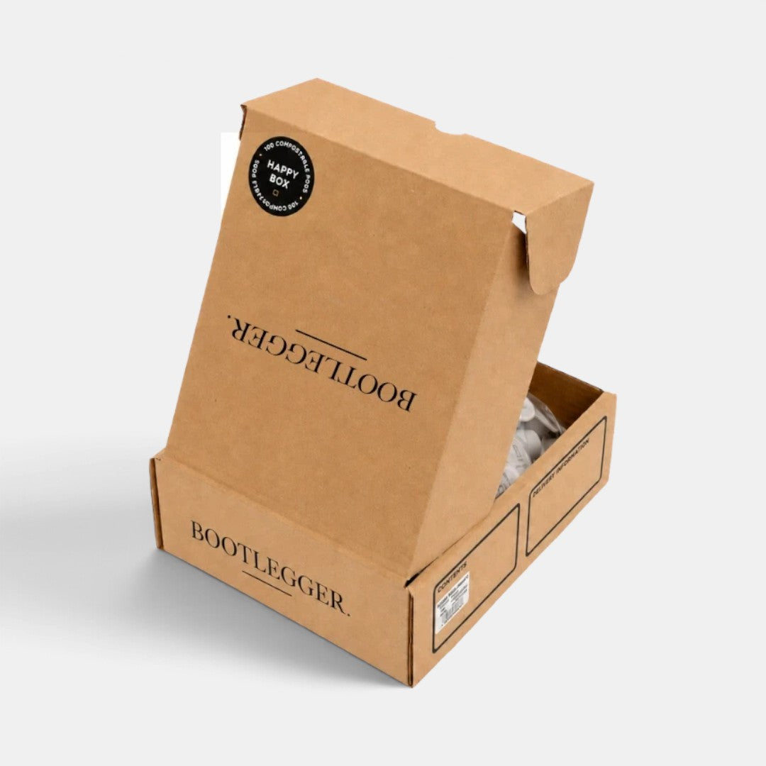 Bootlegger Coffee bulk box containing 100 compostable House Blend coffee capsules in sustainable brown cardboard
