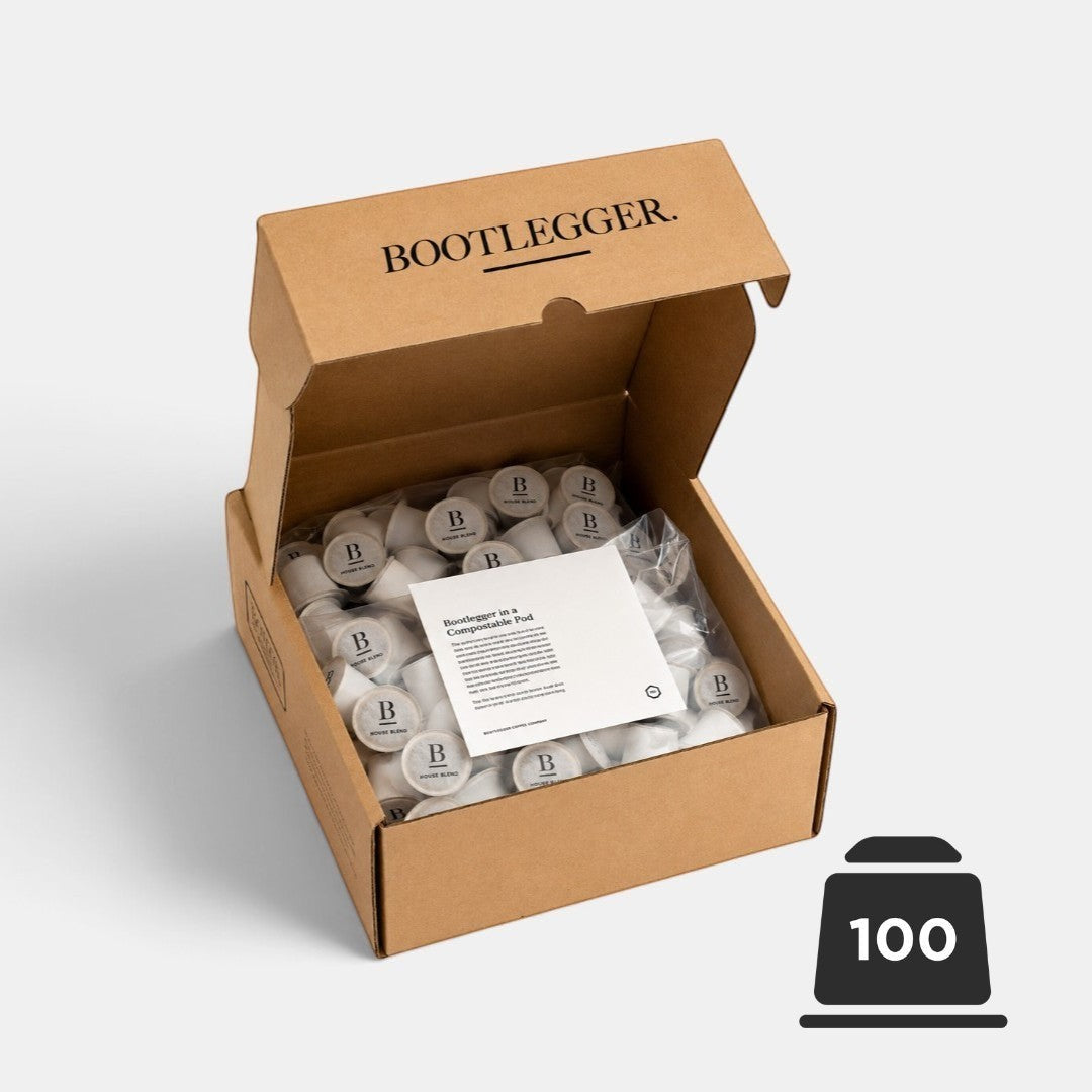 Bootlegger Coffee bulk box containing 100 compostable House Blend coffee capsules in a brown cardboard delivery box.