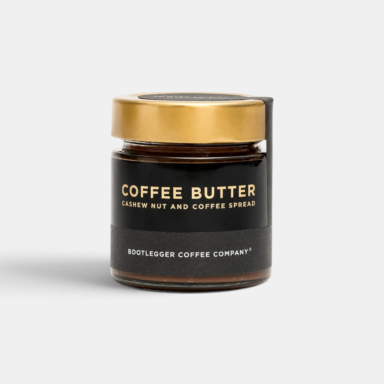 Bootlegger Coffee Coffee Butter cashew nut and coffee spread in a glass jar with a gold lid