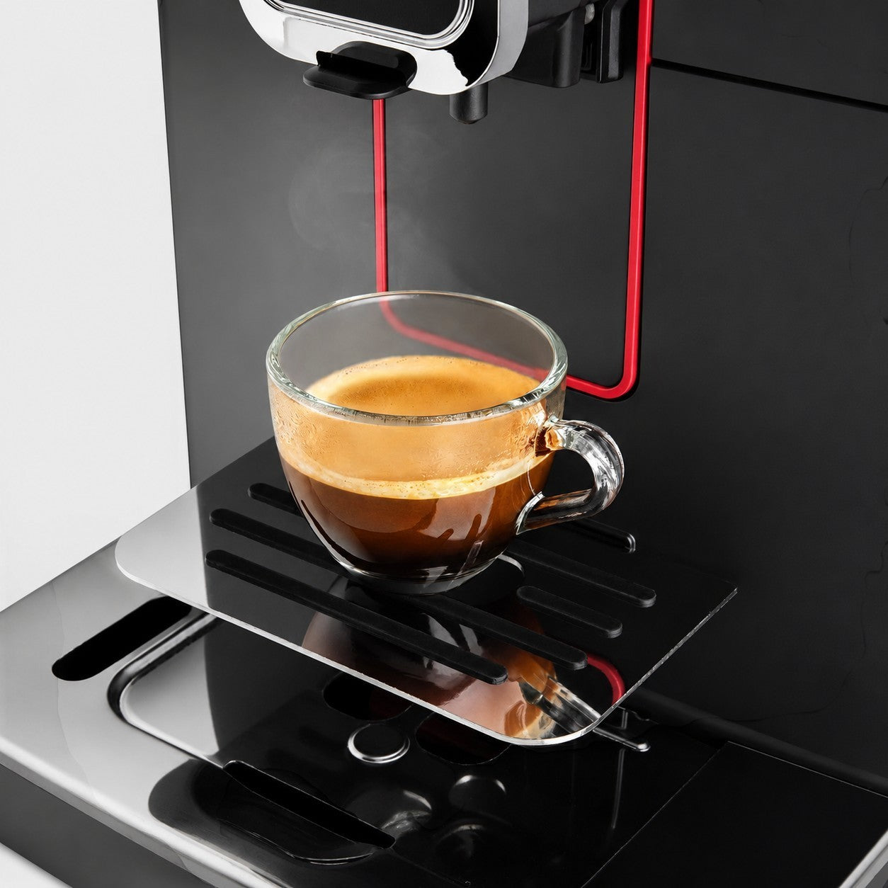 Bootlegger Coffee Gaggia Magenta Plus espresso machine brewing a fresh cup of coffee into a clear glass mug