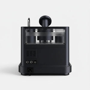 Bootlegger Coffee Meraki espresso machine in matte black, showing the rear view with power cord and ventilation.