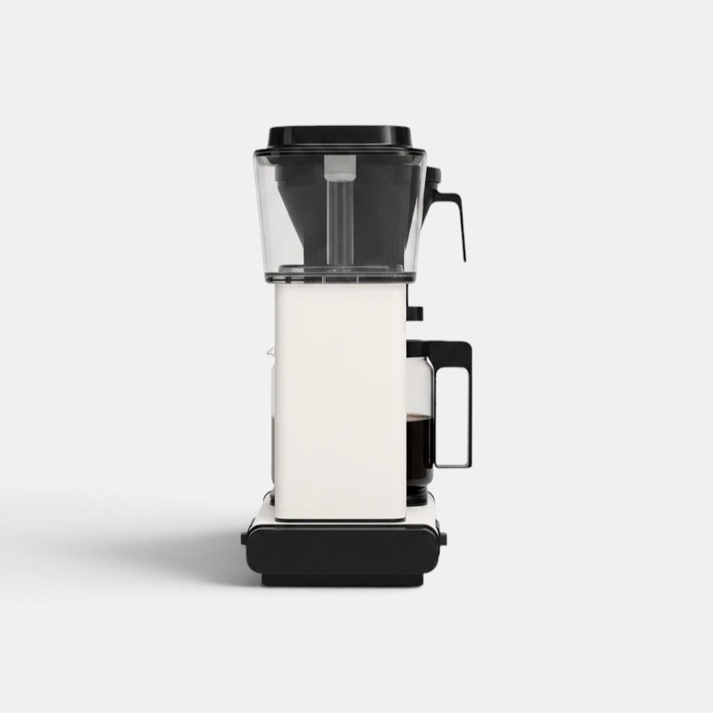 Bootlegger Coffee MoccaMaster Select filter coffee machine in white and black, side profile view.